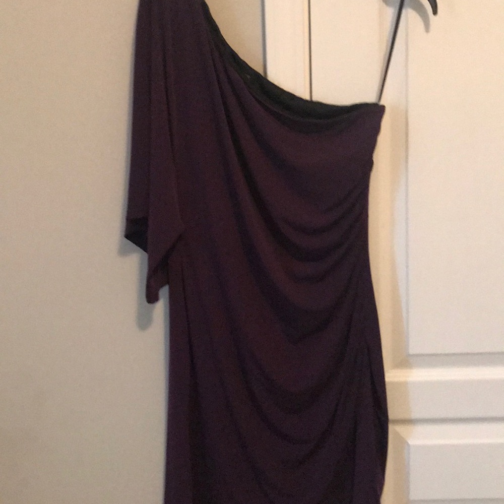 An one off-the shoulder dress.